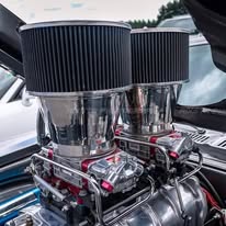 Twin-intake hot rod engine bay with chrome velocity stacks
